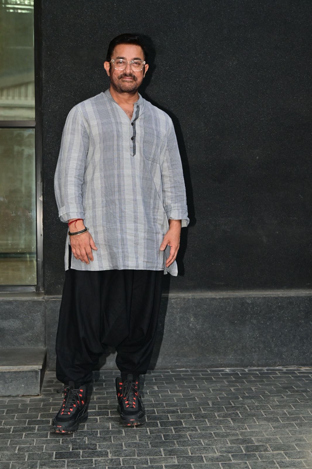Aamir Khan posed for the paparazzi as she went to watch the upcoming film of son Junaid Khan